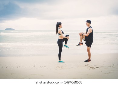 Runners. Young people running on beach. Athletic attractive people jogging on beach enjoying the sun exercising their healthy lifestyle.  - Shutterstock ID 1494060533
