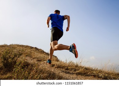 running autumn trail on male athlete runner - Powered by Shutterstock