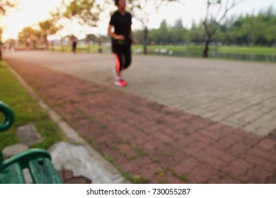 Running blurred  used as backgrounds of  exercise at parks outdoor in morning ,concept for health