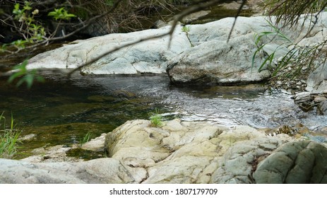 The Running Brook View Between The Mountains In The Countryside