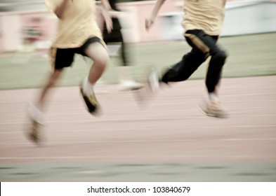 Running Child On Sport Track, Blurred Motion Abstract Background