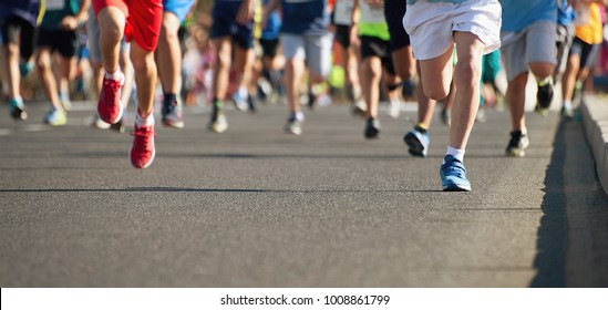 Running Children, Young Athletes Run In A Kids Run Race,running On City Road Detail On Legs