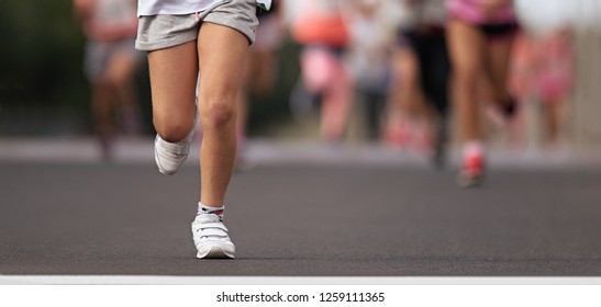 Running Children, Young Athletes Run In A Kids Run Race,running On City Road Detail On Legs, Goal Of The Run