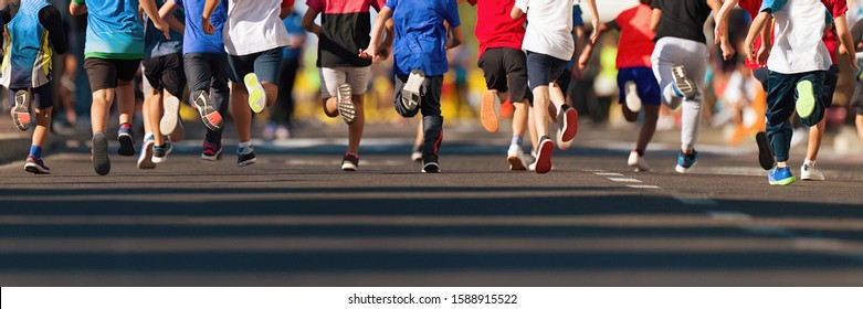 Running Children, Young Athletes Run In A Kids Run Race,running On City Road Detail On Legs