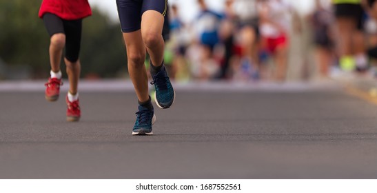 Running Children, Young Athletes Run In A Kids Run Race, Running On City Road Detail On Legs