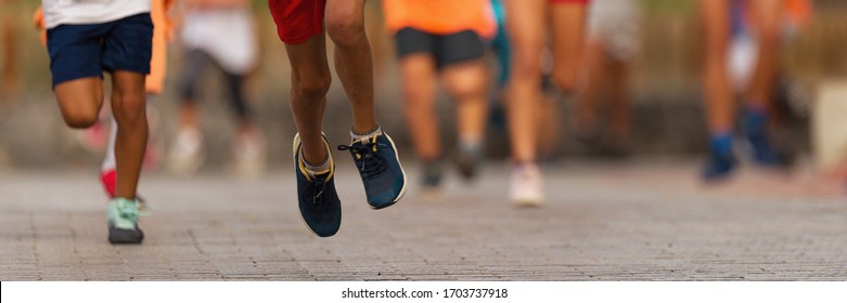 Running Children, Young Athletes Run In A Kids Run Race,running On City Road Detail On Legs