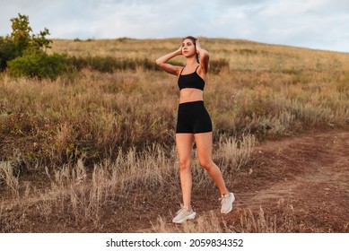 Running In City Park. Woman Runner Outside Jogging With Sunset Nature In Background