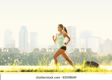 Running In City Park. Woman Runner Outside Jogging With Montreal Skyline In Background