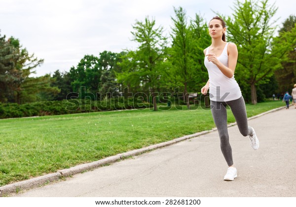 Running Fast Pretty Sportive Young Woman Stock Photo (Edit Now) 282681200