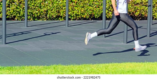 Running Girl In A Sports Uniform At A Training In The Park. Format Banner Header Wide Size, Place Sample Text