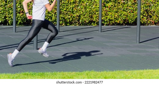 Running Girl In A Sports Uniform At A Training In The Park. Format Banner Header Wide Size, Place Sample Text