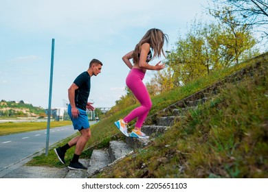 Running Health And Fitness. Runners On Run Training During Fitness Workout Outside On Road. People Jogging Upstairs Together Living Healthy Active Lifestyle Outside In Summer