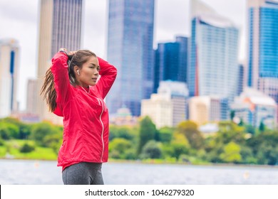 Running healthy lifestyle in urban runner Asian woman getting ready to run morning cardio exercise.