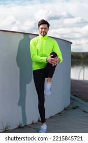 Running and Jogging Concepts. Handsome Caucasian Brunette Man Runner Running And Stretching Legs on Stairs Near River.Vertical Image - Shutterstock ID 2215845721