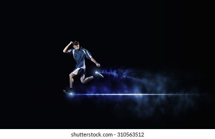 Running Man In Blue Sport Wear On Black Background