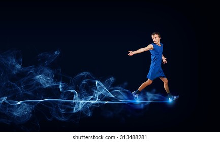 Running Man In Blue Sport Wear On Black Background