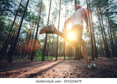 Running man. Male runner jogging at the park. Guy training outdoors. Exercising on forest path. Healthy, fitness, wellness lifestyle. Sport, cardio, workout concept - Powered by Shutterstock