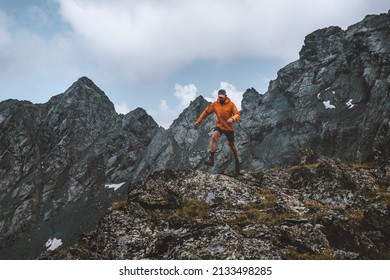 Running man in rocky mountains travel alone hiking adventure active extreme vacations outdoor healthy lifestyle motivation - Shutterstock ID 2133498285