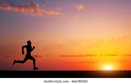 Running Man Silhouette In Sunset Time. Sport And Active Life Concept