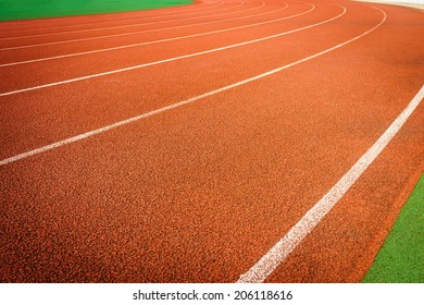 A running racetrack constructed from red rubber cover - Shutterstock ID 206118616