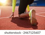 Running shoe of athletic runner training in stadium at sunset, preparing for sports competition, Summer Olympic games in Paris, France