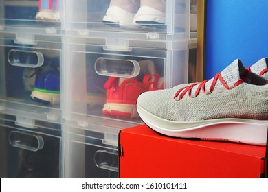 Running Shoe On Box With Sport Shoes Background