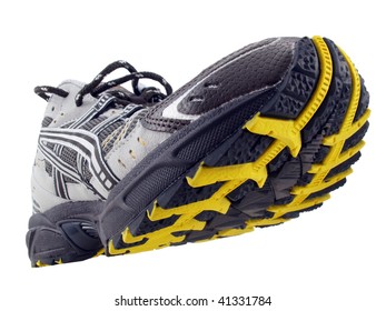 Running Shoe With Yellow And Black Tread Pattern Tilted Up On White