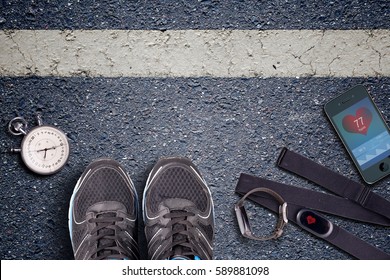 Running Shoes And Stopwatch. Hart Rate Sensor And Watch Whit Pulse. Ready To Run. Running On Asphalt. Control Your Pulse Whit Heart Rate Monitor.