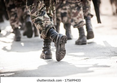 Running Soldiers Carrying Weapons