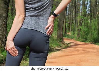 Running, Sport Injury. Woman  Runner With Cramp In The Hamstring Muscles