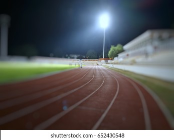 Running Track And Spot Light In The Night Time Blur Effect From The Camera