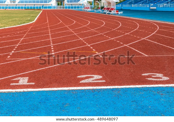Running tracks in an empty\
stadium.