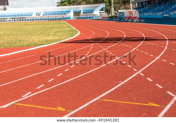 Running tracks in an empty\
stadium.
