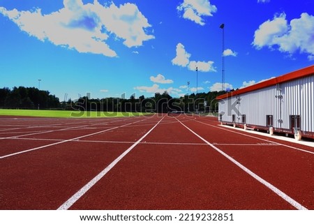 Running tracks at one arena or stadium. Red ground with white lines. Bålsta, Stockholm, Scandinavia, Europe.