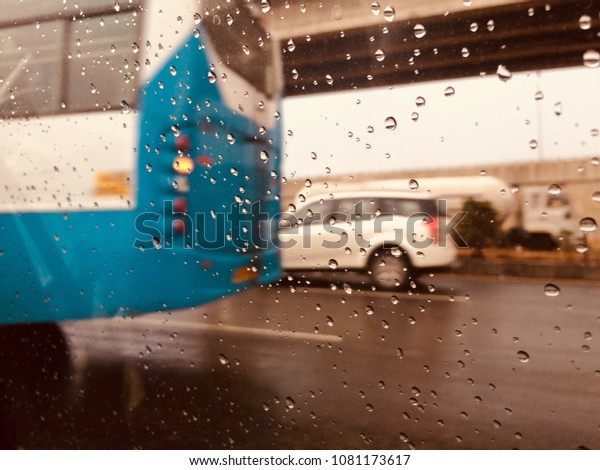 Running vehicles on a wet road captured from\
the inside of a car isolated unique\
photo