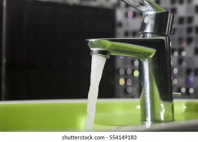 Running Water Faucet In A Bathroom