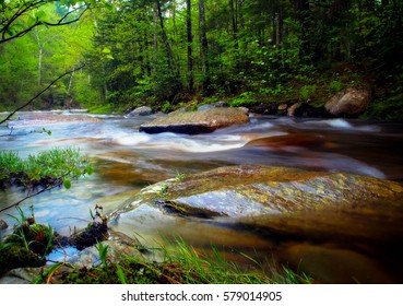 Running water over rocks in Moxie Falls Maine in late summer. - Shutterstock ID 579014905