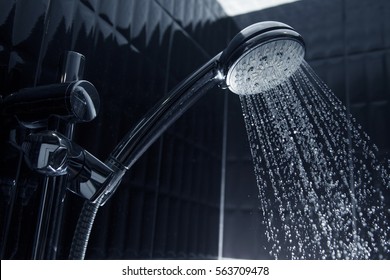 running water of shower faucet - Shutterstock ID 563709478