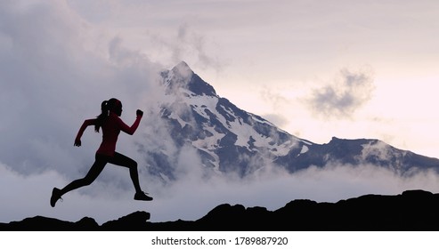 Running woman athlete sport concept. Trail runner exercising in mountain summit background. Female runner on run training outdoors living active fit lifestyle. Silhouette at sunset. - Powered by Shutterstock