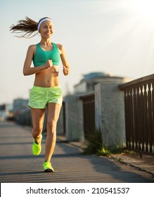 Fitness woman runner running on summer park in the morning Stock Photo by  lzf