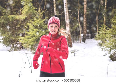 Running Woman In Winter Forest. Trail Running