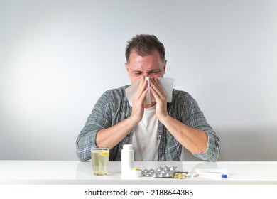 Runny Nose And Flu In A Man - Treatment At Home With Pills And Medical Supplies. High Quality Photo