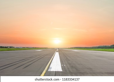 Runway at the airport in the evening sunset sun light