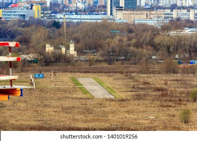 Runway In The Field. Tushino Airfield, Moscow, Russia. Abandoned Airport. Aerial View Of A Runway At Sunset. Airport Airstrip, Runway