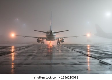 Runway Foggy Night, View Of The Plane From The Tail