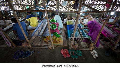 Rupganj, Dhaka Division, Narayanganj District, Bangladesh - 6th March, 2017. Handloom Weavers Creating World Famous Dhakai Jamdani Muslin Sarees Using Cotton And Gold Threads.