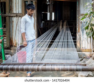 Rupganj, Dhaka Division, Narayanganj District, Bangladesh - 6th March, 2017. Handloom Weavers Creating World Famous Dhakai Jamdani Muslin Sarees Using Cotton And Gold Threads.