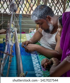 Rupganj, Dhaka Division, Narayanganj District, Bangladesh - 6th March, 2017. Handloom Weavers Creating World Famous Dhakai Jamdani Muslin Sarees Using Cotton And Gold Threads.