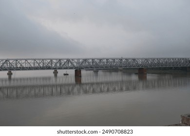 "rupnarayan or kolaghat rail bridge" a significant road-rail bridge that spans across the rupnarayan river in the indian state of west bengal in foggy morning - Powered by Shutterstock