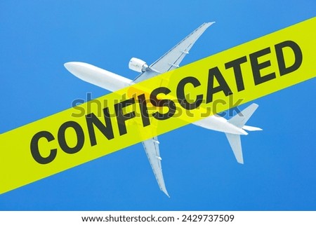 Rupture of the aircraft leasing agreement, confiscation. Aeroplane flying in blue sky and text CONFISCATED